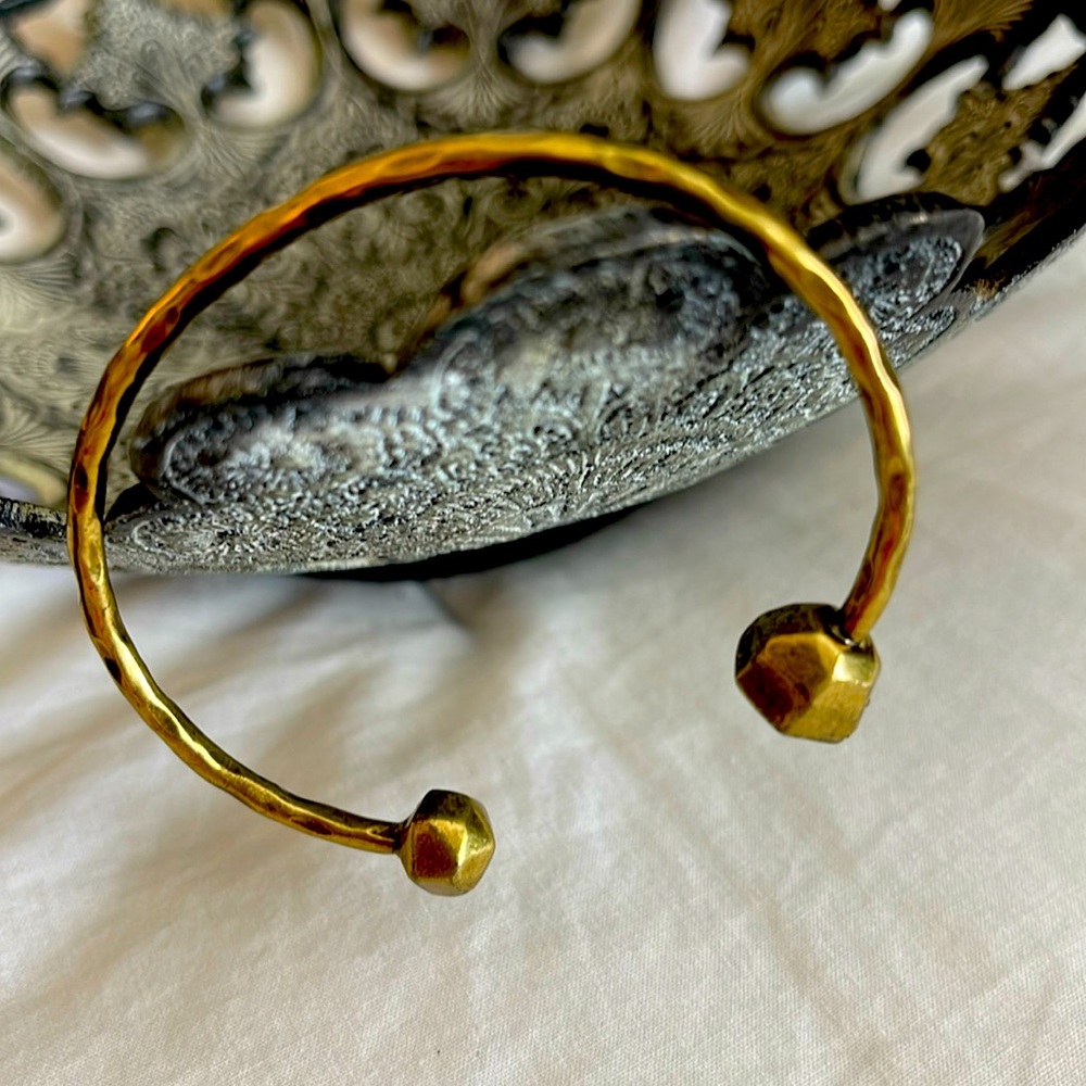 Brass bangle with beautiful details on each end.
